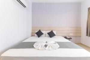 Postel nebo postele na pokoji v ubytování M HOTEL - Medan Tuanku Near MARA