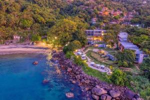 an aerial view of the resort and the beach at Wyndham Ilhabela Casa Di Sirena in Ilhabela