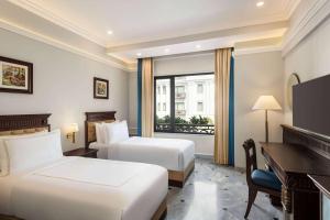 Postel nebo postele na pokoji v ubytování Ramada by Wyndham Goa Vagator