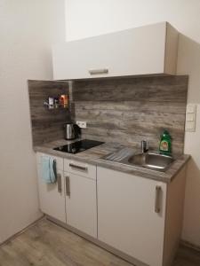a kitchen with a sink and a counter top at Appartment Herten - Auch zur EM 2024 Arena AufSchalke in Herten