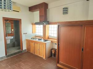a kitchen with a sink and a counter top at CHILCHILL Elite Residences BKK2 in Phnom Penh