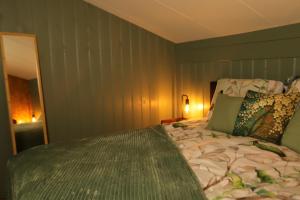 a bedroom with a large bed in a room at Mimosa bed & breakfast in IJsselmuiden in IJsselmuiden