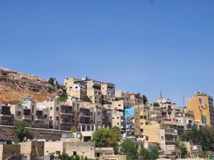 a group of buildings on top of a mountain at Pasha Boutique Hotel in Amman
