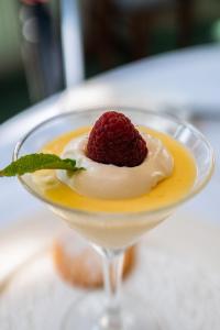 a martini with a raspberry on top in a glass at Seaview House Hotel in Bantry