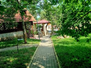 a brick path in a park next to a building at Krolichya ferma in Ivancea