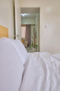 QFandZ Baguio Homestay at BRENTHILL Condominium客房内的一张或多张床位