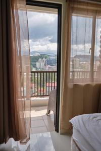 QFandZ Baguio Homestay at BRENTHILL Condominium客房内的一张或多张床位