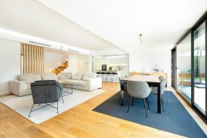 a living room with a table and a couch at Rosario Pool Villa in Cascais +43 photos