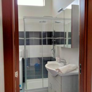 a bathroom with a sink and a shower at DOBA House in Baveno +45 photos