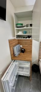 a kitchen with an open drawer with a refrigerator at Hotel Hangar in Mošnov