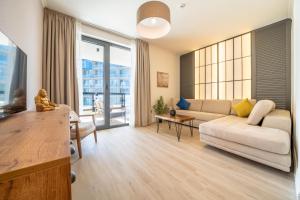TV a/nebo společenská místnost v ubytování Invictus Hotel