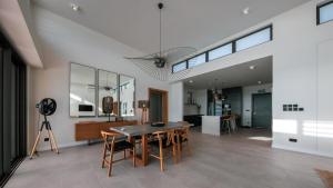 a dining room with a table and chairs at Beach front penthouse in Pereybere in Grand Baie