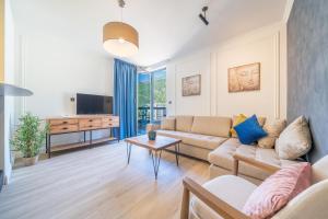 TV a/nebo společenská místnost v ubytování Invictus Hotel