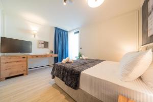 Postel nebo postele na pokoji v ubytování Invictus Hotel