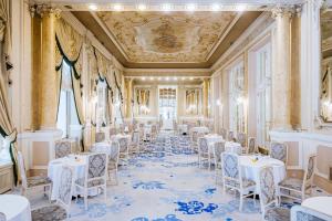 a banquet hall with white tables and chairs at Grandhotel Pupp in Karlovy Vary +37 photos