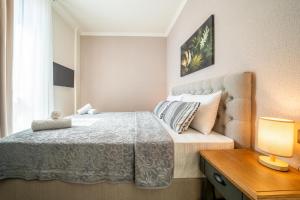 Postel nebo postele na pokoji v ubytování Invictus Hotel