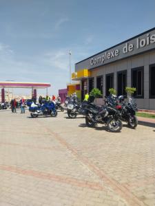 a group of motorcycles parked in front of a building at Complex Amazon Guercif in Guercif