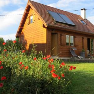 a house with a solar panel on the roof at Maison écoresponsable classée 3 étoiles avec son jardin clos in Donzy
