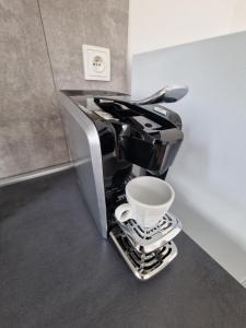 a coffee machine is sitting on a counter at Apartmán Anežka -1- in Jičín +2 photos