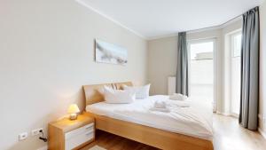 Postel nebo postele na pokoji v ubytování strandnahe FeWo mit Balkon,Residenz Bel Vital 15 + 29 fotografií