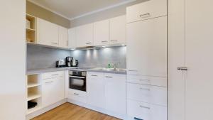 Kuchyň nebo kuchyňský kout v ubytování strandnahe FeWo mit Balkon,Residenz Bel Vital 15
