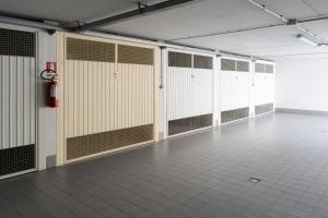 a row of lockers in a room with a tile floor at Seventyfive House in Chioggia