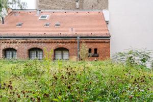 a brick building with a red roof at Wilmina Hotel in Berlin +82 photos