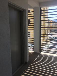 a door in a room with a view of a building at Ne parliamo Stasera in Porto Santo Stefano