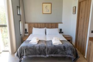 Ένα ή περισσότερα κρεβάτια σε δωμάτιο στο Monturiol Apartaments