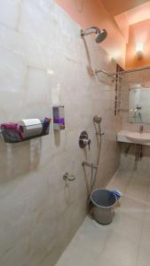 a bathroom with a shower and a sink at D2Stay Homestay 2Bhk for 5person Near Paltan Bazar in Guwahati