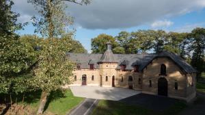 an aerial view of a house with a roof at Domaine des Hayes in Maxent