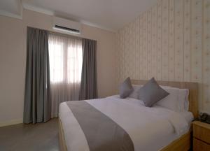 Postel nebo postele na pokoji v ubytování Comfy apart hotel