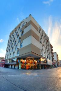 a large building on a street in a city at Provincial Plaza Hotel in Salta