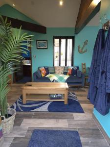 a living room with a couch and a coffee table at Farm Elegance at Lottie's Lodge in Hutton