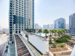 a view of a city skyline with tall buildings at Comfy 1BR in Damac Maison Prive by Huaxia Homes in Dubai