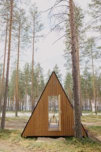 a small house in the middle of a forest at Pistocamp in Puumala