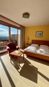 Postel nebo postele na pokoji v ubytování Hotel Garni am Seggauberg