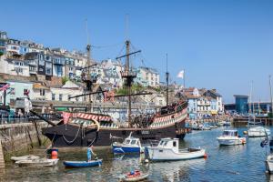 a group of boats are docked in a harbor at Cottage in the Heart of Brixham in Brixham