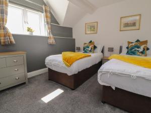 Llit o llits en una habitació de Stork Cottage