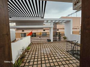 a view of a balcony of a building at Kshipra Home Stays in Ujjain +1 photo