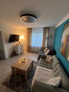 a living room with a couch and a coffee table at Maja Appartement in Bad Schwartau