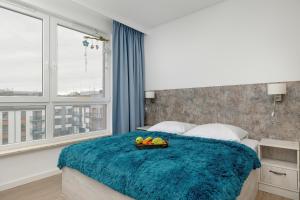 Ένα ή περισσότερα κρεβάτια σε δωμάτιο στο Apartamenty Bel Mare SeaView by Rent like home