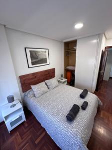 Ένα ή περισσότερα κρεβάτια σε δωμάτιο στο Apartamento centro y playa de Gijon
