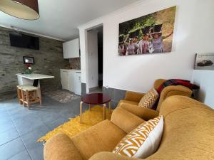 a living room with a couch and a table at Quinta Da Estrada Winery Douro Valley in Peso da Régua