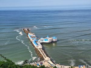 an aerial view of a resort in the ocean at Habitacion baño Propio La Paz 1 in Lima
