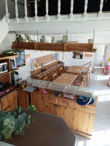 a kitchen with wooden cabinets and a counter top at Atatau hostel in La Paz