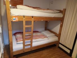 a couple of bunk beds in a room at Atatau hostel in La Paz