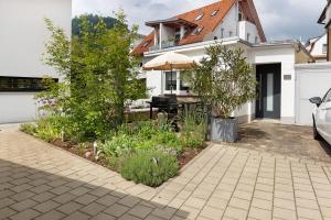 a garden in the backyard of a house at Apartment am Hohentwiel in Singen