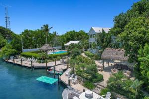 an aerial view of a resort with a swimming pool at Isla Mirabelle - Waterfront Boutique Resort, Htd Pool, Dock, Walkable in Islamorada