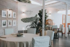 a dining room with a table and chairs at Santa Catalina, a Royal Hideaway Hotel in Las Palmas de Gran Canaria